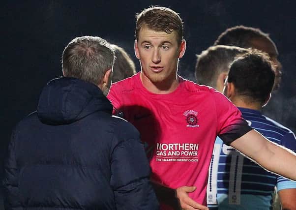 Scott Harrison talks to Craig Hignett after Wycombe's second goal