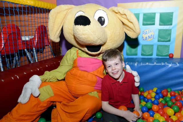 Alfie Smith in the ball pool with Mr Twister.