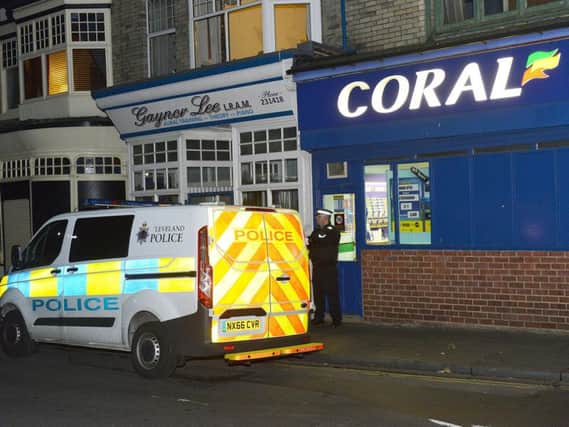 A police Officer outside of Coral Bookmaker Stranton Green, Hartlepool.