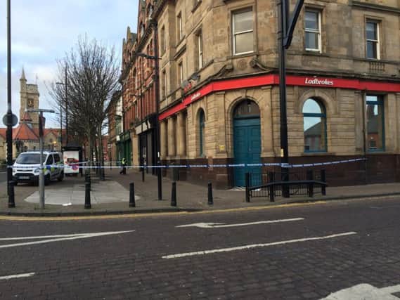 The area outside Ladbrokes in Church Street cordoned off this morning.