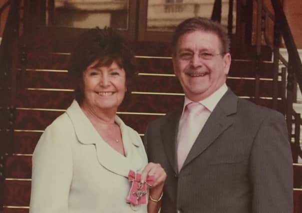 Wendy and John with her MBE.