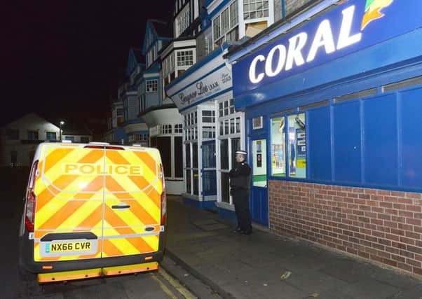 A police Officer outside of Coral Bookmaker Stranton Green, Hartlepool. Picture by FRANK REID