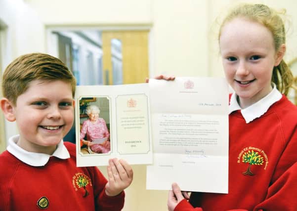 St Aidans Primary School head boy Callum Bromley and head girl Emily Heslop with their letter from the Queen.