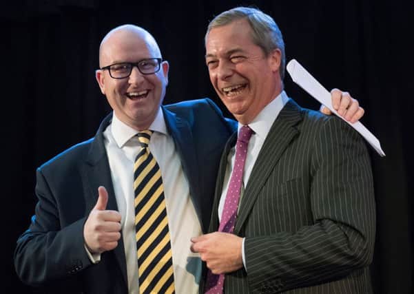 Paul Nuttall is congratulated by Nigel Farage after he was announced as the new Ukip leader at the Emmanuel Centre in Westminster, London. Credit: PA.
