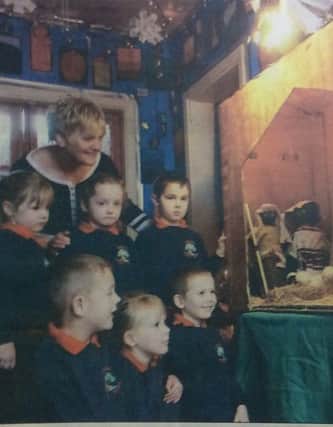 Eileen Fallow and the children of Hesleden Primary School at the festival launch in 2004.