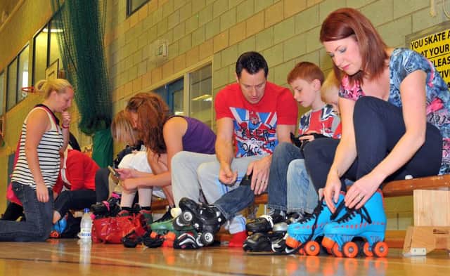 Getting their roller skates on for the 2012 Jubilee Roller Disco at the Headland Sports Centre.