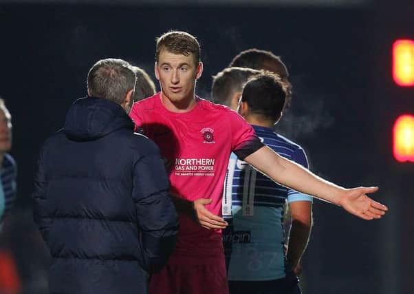Scott Harrison explains to Craig Hignett what happened after they conceded a second goal at Wycombe. Picture by Gareth Williams/AHPIX.com.