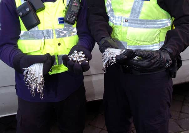 The 'Jingle Bells' and lanyards which police are giving out to shoppers.  Pic: Malcolm Billingham.
