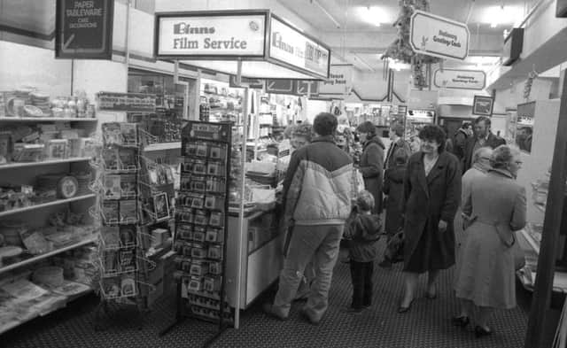 A busy scene around the Binns store Film Service counter.