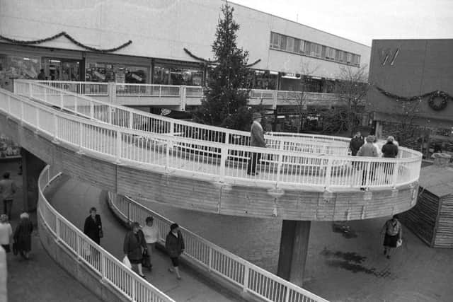 The curly ramp in Hartlepool Shopping Centre with a Christmas tree protruding through the centre 23 years ago..