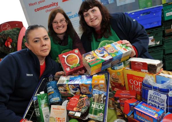 Tesco's Community Champion Selina Wilson, left, with foodbank trustee Laura Wild, and Tesco colleague Tracey Barker, collecting donations at the Burns Road store, Hartlepool.