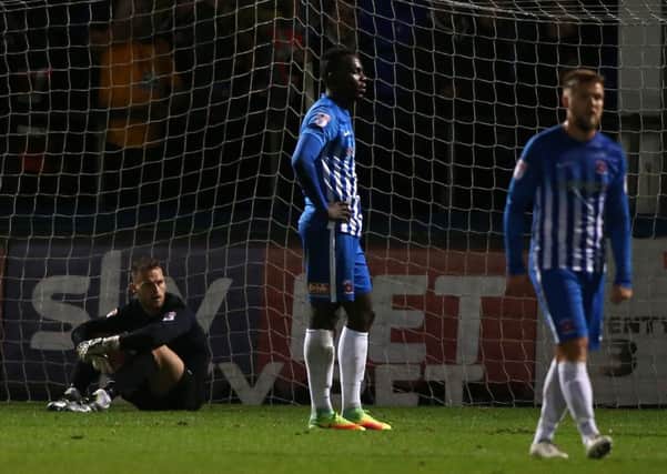 Pools players react after Cambridge's fourth goal