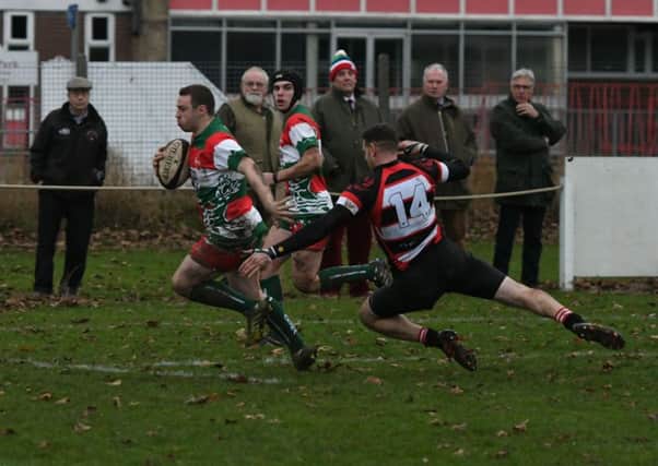 Zac Southern goes through for a try for West