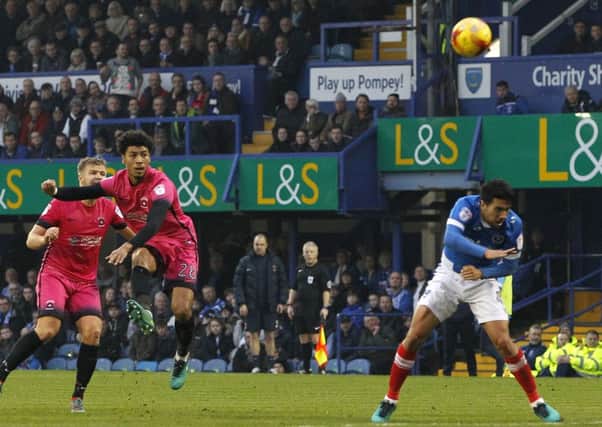 Josh Laurent tries his luck from distance at Fratton Park