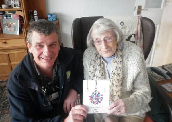A residents receives a Christmas card as part of the project devised by Hartlepool Borough Councils Home Library Service.