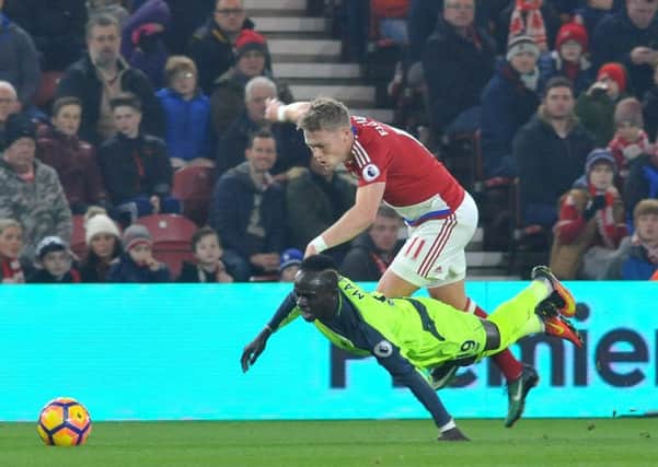Boro's Viktor Fischer brings down Sadio Mane. Picture by TOM COLLINS