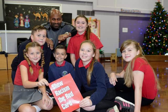 Former professional footballer Dean Gordon with Rift House Primary School pupils Brandon Tobin, Laurie I'Anson, Connie Gardner, Darrian McCabe, Georgia Marshall and Jack Wallace.