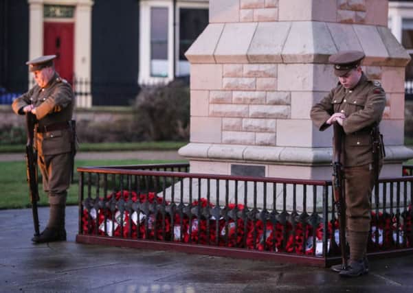 The annual Bombardment Remembrance Ceremony at Hartlepool Headland. 

The Durham Pals stand by the memorial.

Picture: TOM BANKS