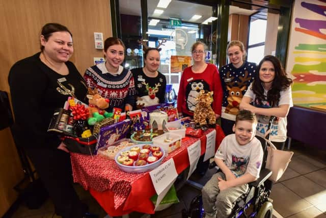 Alfie Smith with mum Annie Stalley and staff from McDonalds, Hartlepool, where they held a cake sale and raffles in aid of Alfie's fund