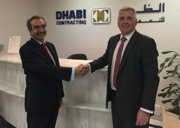Dhabi Contractings Sami Edwards, left, with Nortechs Bryan Bunn.