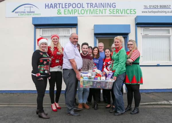 Staff at Hartlepool Training have been raising money for Hartlepool Foodbank by wearing Christmas jumpers to work. Picture: TOM BANKS