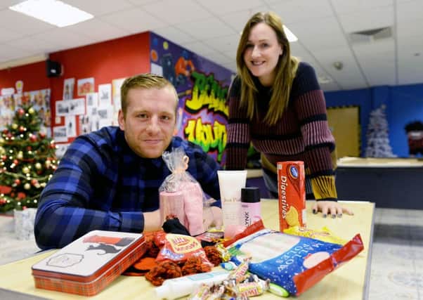 James Pallister and Claire Ashley from Project 85 with items  that they are giving out to vulnerable people this Christmas  Picture by FRANK REID