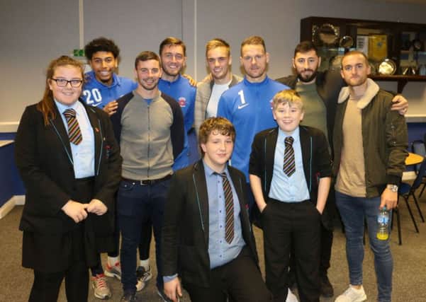 Hartlepool United players with pupils at the Christmas party.