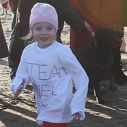 Little Olivia Brackstone braved the icy sea to do a Boxing Day Dip in memory of her mum, Melanie, who died in November aged just 31.