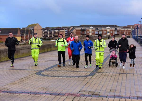 New Year's Day and Paul Suggitt (third left) from Hartlepool starts his 10,000 miles in 365 days challenge, running, cycling or walking helped by friends and family for the first mile.