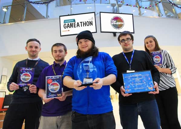 Part of the GameCon team with their award, L-R: Mark Lee, Thomas Atkinson, Rory Williamson, Thomas Black and Erin Blackett at Hartlepool College of Further Education.