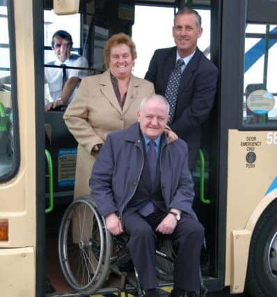John Cummings MP, pictured in 2007, as he tries out a wheelchair on the new bus service at Dalton Park, pictured with service delivery manager Stuart Wilson and Councillor Joyce Maitland.
