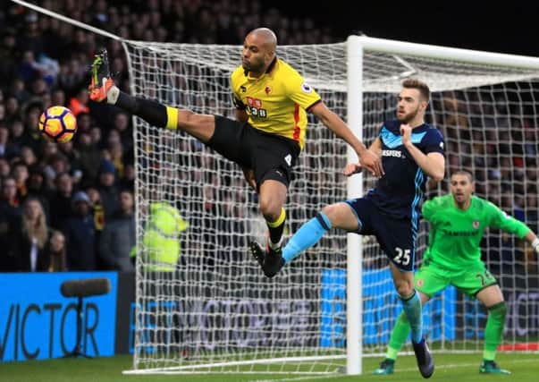 Middlesbrough's Calum Chambers keeps close to Watford's Younes Kaboul