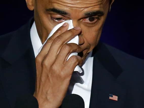 President Barack Obama wipes his tears as he speaks at McCormick Place in Chicago, Tuesday, Jan. 10, 2017, giving his presidential farewell address. (AP Photo/Charles Rex Arbogast)