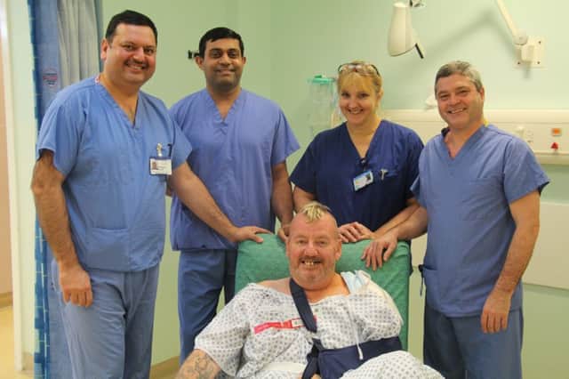 Pictured left to right with patient Malcolm Payne are Mr Rajesh Nanda, Dr Austin Mathews, sister Pauline Barnes and surgical assistant practitioner Mark Saunders.