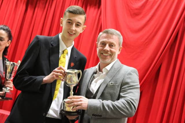 Nathan Cross receiveing his award as a representative for Year 10 &11 Town Cross Country champions