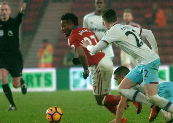 Adama Traore tries to press forward for Middlesbrough against West Ham