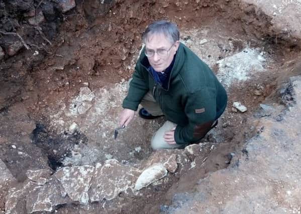 Archaeology officer Robin Daniels in the trench behind Gladstone Street