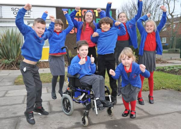 Throston Primary School pupils celebrate their good Ofsted report.
