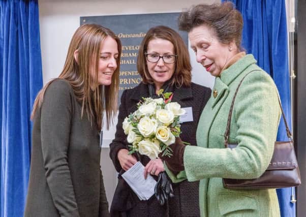 Eve Bennett-Townsend presenting posy to HRH The Princess Royal with Principal Suzanne Duncan