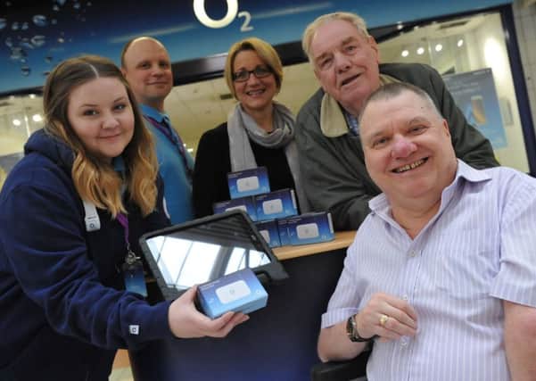 O2's Amy Tucker hands over the WiFi hotspots to Michael Slimings, with Ben Jones, Jeanette Willis and Bob Bousfield.