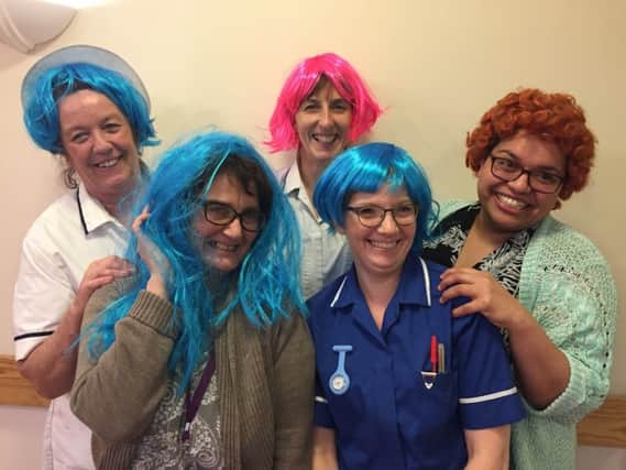 Hospice staff get into the Mad March Hair spirit.