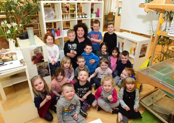 Headteacher at Wingate Nursery School, Partridge Terrace, Wingate,  Becky Wood and some of her pupils celebrate an outstanding Ofsted.