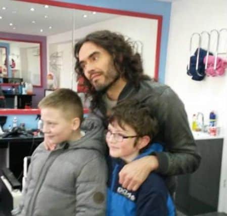 Russell Brand, snapped by Violet Draper, as he nephews Anthony Draper, 10, and Aiden Draper, 11, have their photo taken with him.