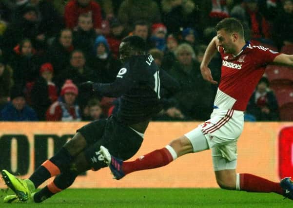 Boro's Ben Gibson challenges Everton's Romelu Lukaku