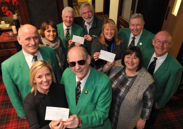 Members of Hartlepool Male Voice Choir hand donations to representatives from Hartlepool Blind Welfare, Mind and Macmillan Nurses.