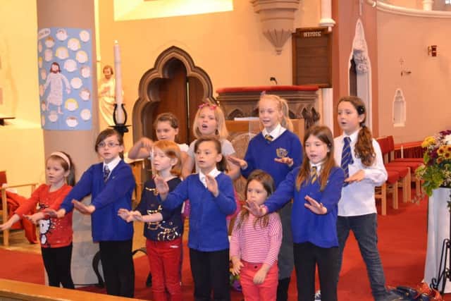 St Bega's pupils perform a song for the congregation during the 2011 Youth Sunday celebration in St Mary's Church of The Immaculate Conception, Headland, Hartlepool.