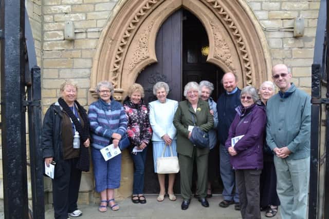 Parishioners gather with parish priest Fr Nick Jennings (4th right) at the entrance of St Mary's Church of The Immaculate Conception, Headland, Hartlepool.