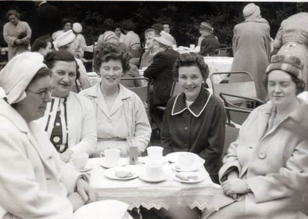 Ladies of the parish enjoying tea in the garden for Canon Burkes's Jubilee in St Mary's Church of The Immaculate Conception, Headland, Hartlepool.