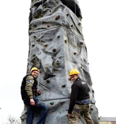David Laidlaw (37) left on the climbing wall with Private Andrew Taylor as he visited Army display in Church Square, Hartlepool. Picture by FRANK REID