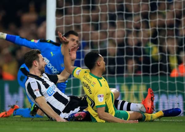 Jacob Murphy pounces from close range, after a Jamaal Lascelles mistake, to haul Norwich level at 1-1 last night.